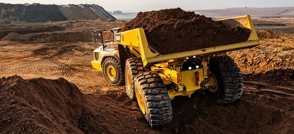 loaded articulated truck at a jobsite