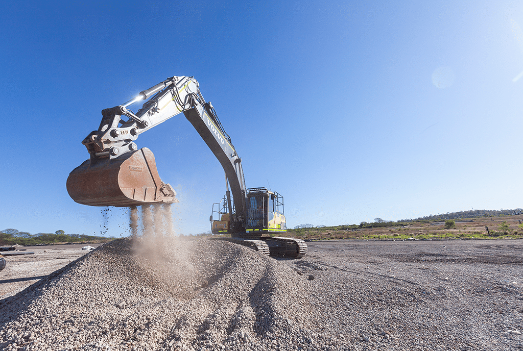 volvo machinery scooping materials at a worksite