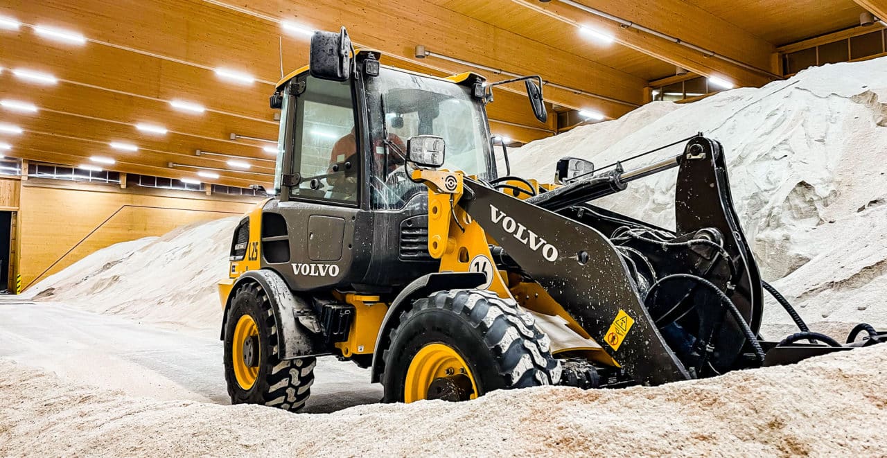 a volvo loader inside a warehouse